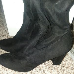 Black thigh high boots.